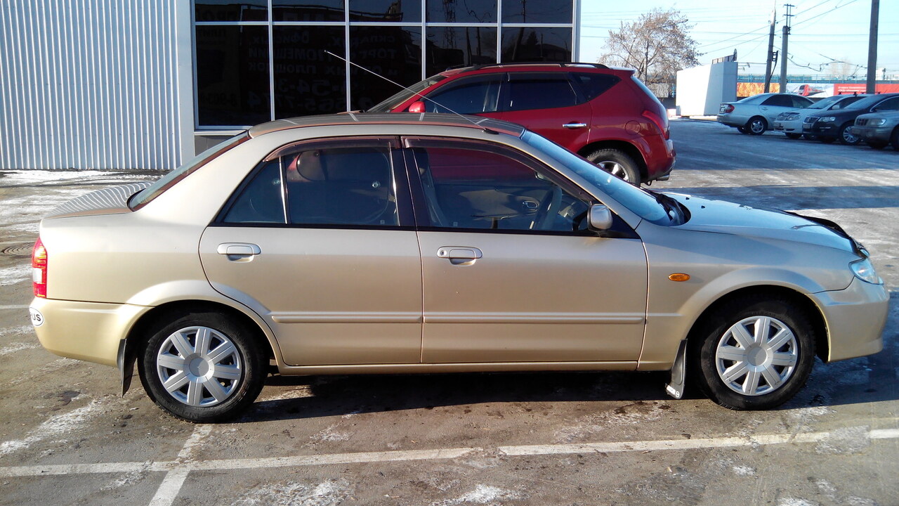 Автомобиль фамилия. Mazda familia 2001 седан. Мазда Фэмили седан 2001. Мазда 323 фамилия 2001 года седан. Мазда фамилия 2001г.